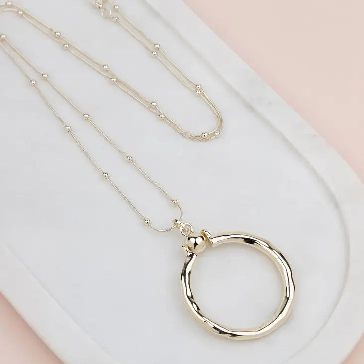 Gold Ring with Ball Necklace